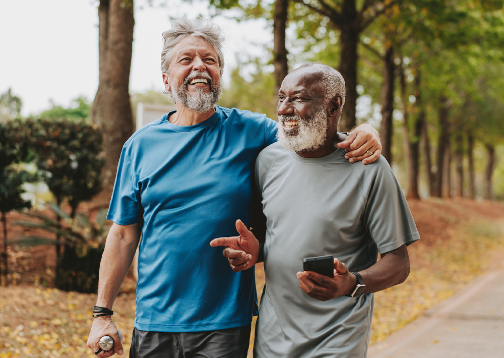 Two men walking outside and laughing