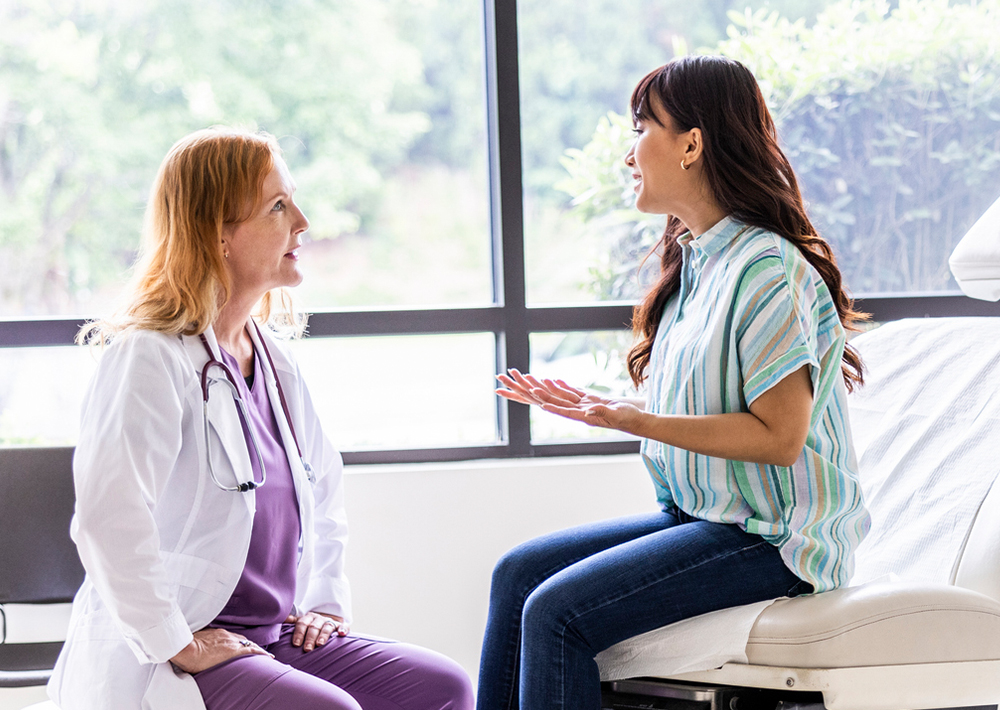 A patient discusses her health with her provider.