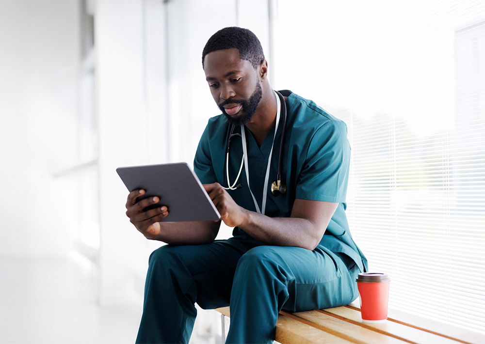 Doctor looking at iPad