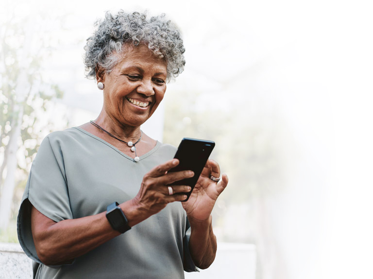 Older woman looking at phone